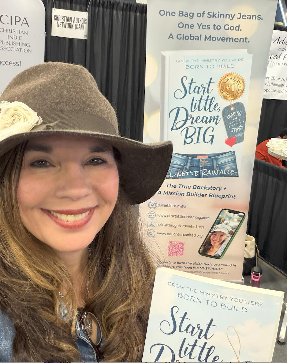 Linette Rainville in front of an image with her book Start Little Dream Big